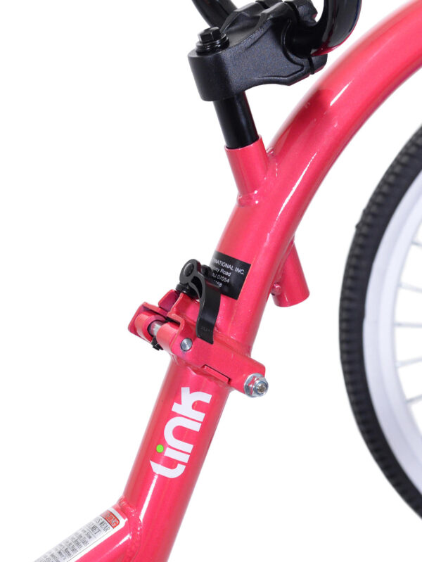 Close-up of Pink tag-along bike
